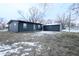 Dark gray house with detached garage, winter backyard view at 1384 Cross St, Martinsville, IN 46151