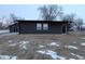 Single story home with dark siding and a black front door at 1384 Cross St, Martinsville, IN 46151