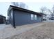 Dark gray siding, single story home with detached garage at 1384 Cross St, Martinsville, IN 46151