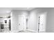Modern hallway with gray walls, white doors and vinyl wood floors at 1384 Cross St, Martinsville, IN 46151
