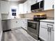 Modern kitchen with white shaker cabinets and stainless steel appliances at 1384 Cross St, Martinsville, IN 46151