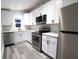 Modern kitchen with white shaker cabinets and stainless steel appliances at 1384 Cross St, Martinsville, IN 46151