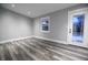 Bright and airy living room with gray walls and vinyl wood flooring at 1384 Cross St, Martinsville, IN 46151
