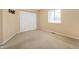 Bright bedroom with neutral walls, carpet flooring, and double-door closet at 1423 Chesterfield Dr, Anderson, IN 46012