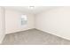 Simple bedroom with neutral walls, carpet, and a window at 14379 Pendragon Way, Fishers, IN 46037