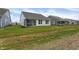 Well-maintained backyard with green lawn and a view of the home's rear exterior at 19349 Sumrall Pl, Westfield, IN 46074