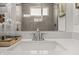Bathroom featuring stylish faucet and light-colored quartz countertop with an inset sink at 19349 Sumrall Pl, Westfield, IN 46074