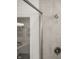Bathroom with glass shower doors featuring neutral tile and modern shower fixtures at 19349 Sumrall Pl, Westfield, IN 46074