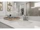 Bathroom featuring stylish faucet, quartz countertop, decorative glass bottles, and cactus themed prints at 19349 Sumrall Pl, Westfield, IN 46074