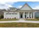 Charming one-story white home with a welcoming front porch and a well-manicured lawn at 19349 Sumrall Pl, Westfield, IN 46074