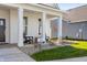 Inviting front porch with rocking chairs, landscaping, and a charming entrance offers a cozy welcome at 19349 Sumrall Pl, Westfield, IN 46074