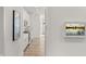 Hallway view showcases modern interiors, lighting, and an integrated home monitoring touchscreen display at 19349 Sumrall Pl, Westfield, IN 46074
