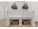 Clean white mud room with storage bench, hooks, and decorative wooden crates at 19349 Sumrall Pl, Westfield, IN 46074