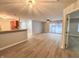 Spacious living room with wood-look floors and sliding glass doors at 240 Legends Creek Pl # 104, Indianapolis, IN 46229