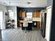 Kitchen with wood cabinets, kitchen island, and gray walls at 3241 Bristlecone Ct, Whiteland, IN 46184