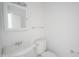 A clean bathroom with a vanity, mirror, towel bar, and toilet at 3246 Tupelo Dr, Indianapolis, IN 46239