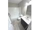 Bathroom with shower/tub combo, vanity, and tile floor at 3411 Xenia Cir, Indianapolis, IN 46227