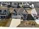 Aerial view of a two-story home featuring a three car garage in a suburban neighborhood at 4061 Omaha Dr, Bargersville, IN 46106