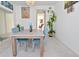Dining room featuring a rustic wood table and blue chairs at 4061 Omaha Dr, Bargersville, IN 46106