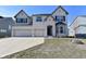 Charming two-story home with a three car garage and well-manicured front lawn at 4061 Omaha Dr, Bargersville, IN 46106