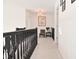 Upstairs hallway with chandelier and seating area at 4061 Omaha Dr, Bargersville, IN 46106
