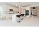 Bright kitchen featuring white cabinets, stainless steel appliances, an island with bar stools, and ample counter space at 4061 Omaha Dr, Bargersville, IN 46106