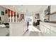 Open concept kitchen with farmhouse sink and white cabinetry at 4061 Omaha Dr, Bargersville, IN 46106