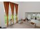 Bright living room with high ceilings, large windows, and comfortable seating area, with view to the backyard at 4061 Omaha Dr, Bargersville, IN 46106