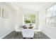 Breakfast nook with glass table and white chairs at 4367 Central Ave, Indianapolis, IN 46205