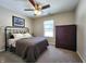 Bedroom with ceiling fan, dresser, and large window at 4624 Hogan Cir, Plainfield, IN 46168