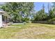 Expansive backyard features a well-maintained lawn and mature trees at 475 Golf Ln, Indianapolis, IN 46260