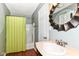 This bathroom features a shower/tub combination and traditional-style vanity that provides great storage solutions at 475 Golf Ln, Indianapolis, IN 46260