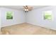Bedroom with carpet, ceiling fan, and natural lighting at 475 Golf Ln, Indianapolis, IN 46260