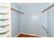 This closet features built-in shelving and hanging rods, great for keeping your wardrobe organized and accessible at 475 Golf Ln, Indianapolis, IN 46260