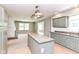 Bright kitchen and open living space with fireplace at 475 Golf Ln, Indianapolis, IN 46260