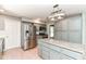 Bright kitchen with stainless steel appliances, wood floors, and island at 475 Golf Ln, Indianapolis, IN 46260
