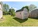 Backyard shed with double doors offers outdoor storage space at 475 Golf Ln, Indianapolis, IN 46260