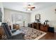 Home office with hardwood floors, built-in shelving and large window at 5004 Coventry Park Cir, Indianapolis, IN 46237