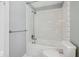 Clean bathroom with subway tile shower and white fixtures at 5108 N College Ave, Indianapolis, IN 46205