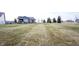 Large backyard lawn with neatly mowed stripes and a view of the house at 5328 Covington Ave, McCordsville, IN 46055