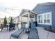 Comfortable backyard patio with lounge chairs and a dining area at 5328 Covington Ave, McCordsville, IN 46055