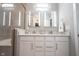 Double vanity bathroom with white cabinets and a frameless shower at 5328 Covington Ave, McCordsville, IN 46055