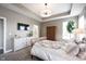 Main bedroom with large bed, TV and ensuite bathroom at 5328 Covington Ave, McCordsville, IN 46055