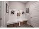 White bench with built-in storage in laundry room at 5328 Covington Ave, McCordsville, IN 46055