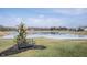 Landscaped grassy area with a bench overlooking a partially frozen pond at 5328 Covington Ave, McCordsville, IN 46055