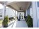 Covered patio with seating and a sliding glass door at 5328 Covington Ave, McCordsville, IN 46055