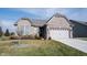 Brick ranch home with attached two-car garage and manicured lawn at 5328 Covington Ave, McCordsville, IN 46055