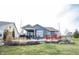 Gray house with a large backyard patio and landscaping at 5328 Covington Ave, McCordsville, IN 46055