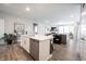 Open concept kitchen with island and living room view at 5328 Covington Ave, McCordsville, IN 46055