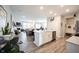 Open concept kitchen with island and white cabinets at 5328 Covington Ave, McCordsville, IN 46055